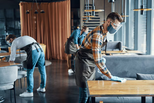 Expert floor cleaning professional using advanced tools to clean a shiny surface.