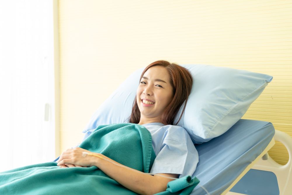 A female patient smiling in hospital